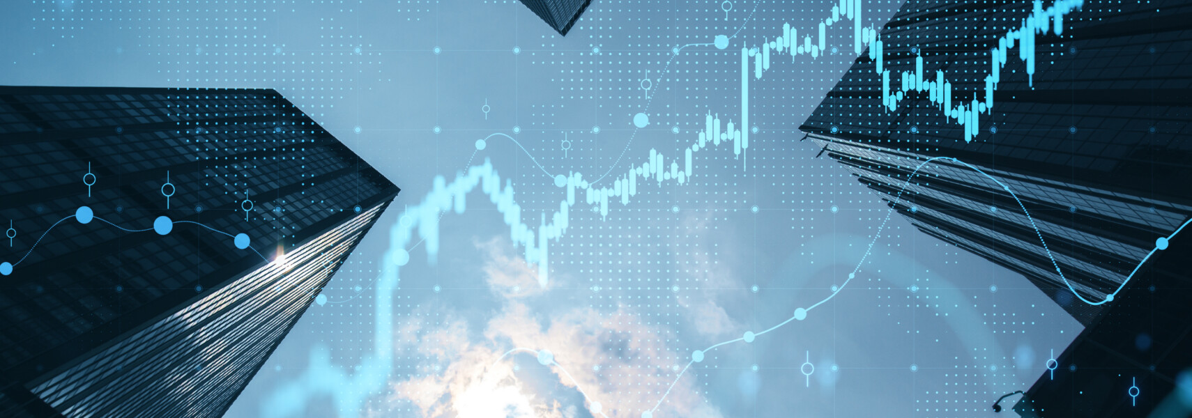 Real Estate And Investment Concept With Bottom View On Sunny Skyscrapers Tops And Digital Financial Chart With Stock Market Diagram